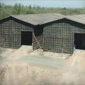 Bamboo-structured monsoon sheds used for temporary storage