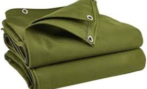 Green cotton canvas tarpaulin by eco-friendly tarpaulin supplier – breathable and sustainable covering solution.